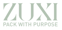 ZUXI "Pack With Purpose" wordmark logo in sage green on a transparent background.